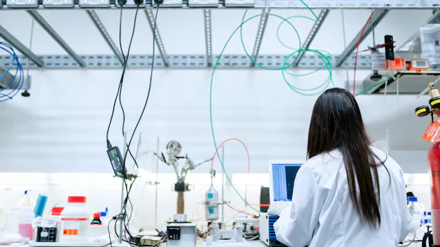 Scientist working on a laptop in a laboratory