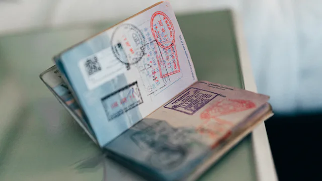 Open passport with visa and entry stamps